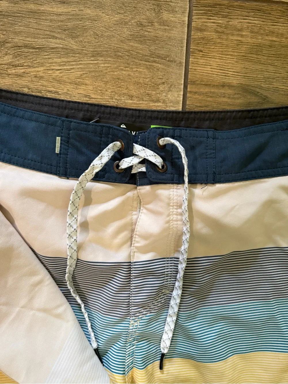 Quiksilver Men’s White Swim Shorts with Blue, Gray & Yellow Stripes